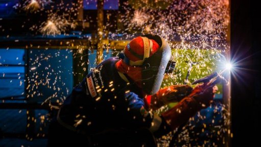 An image of a welder welding