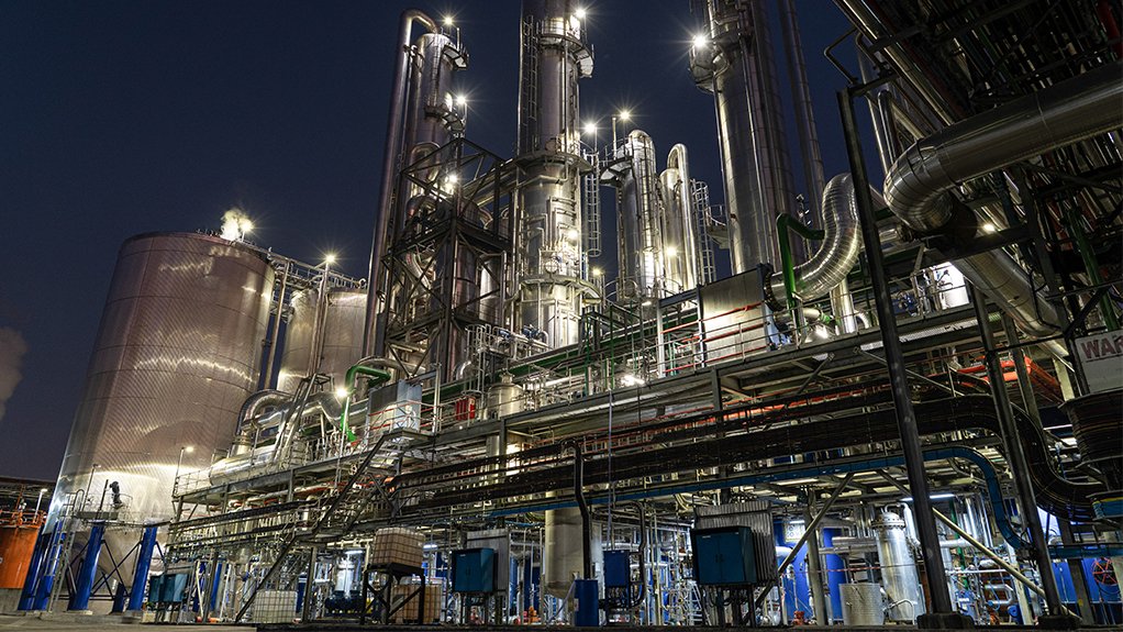 An image depicting the AlcoNCP distillery at night, illuminated by lighting solutions provided by Beka Schréder