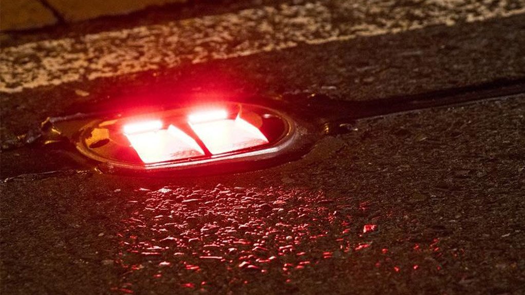 Image of in-road warning lights at two pedestrian crossing along Buitengracht street in Cape Town