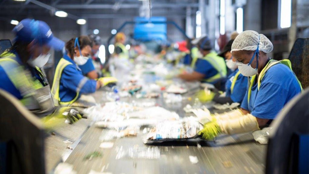 A photo of Averda employees sorting waste