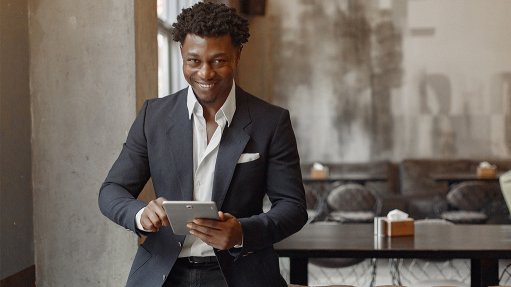 Image of a person using a tablet to show that PRP Solutions helps employees qualify for Employment Tax Incentive scheme benefits