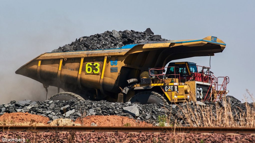 An image of a mining truck transporting coal