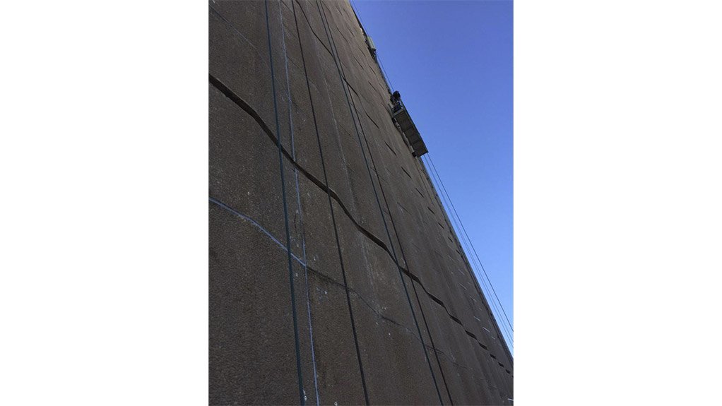 Once secure, the surface of the concrete panels was prepared for the repair work, with oil and grit stains removed using a high-pressure jet spray