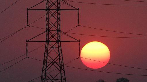 An image of an electricity pylon and the sun 