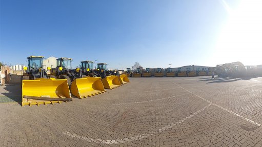 Wheel loaders and excavators lined up after being assembled by Lovemore Bros at its Boksburg facility