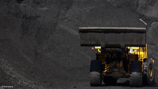 Image shows a truck with coal heaps