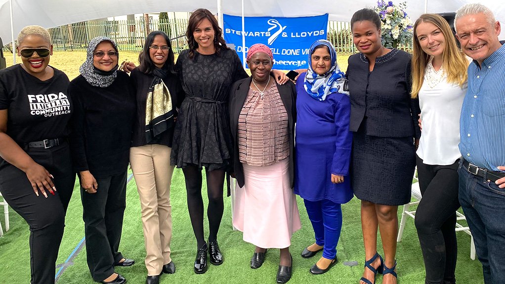 An image of Ovakado's Vicky Dockray, standing posing with charity organisation representatives 