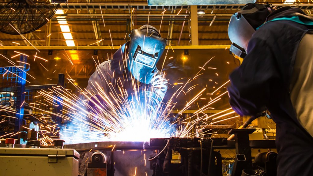 An image of two welders welding.