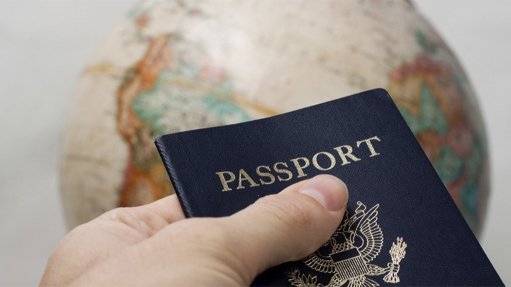 Image of a passport with world map in background