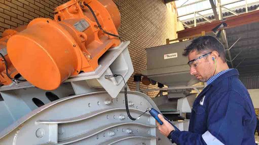 Image of maintenance personnel assessing equipment 