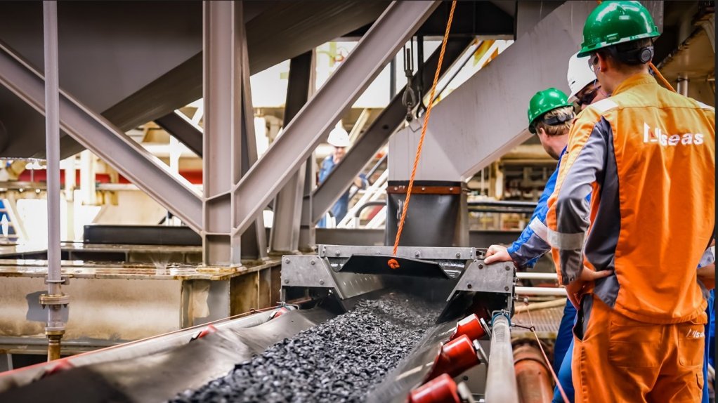 Engineers inspect polymetallic nodules transported from the ocean surface.