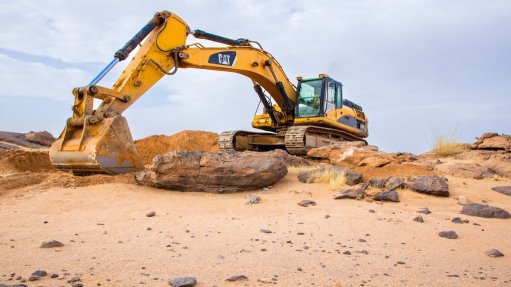 Image of an excavator at work at the Dasa uranium project