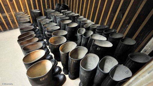 Image shows mining boots lined up