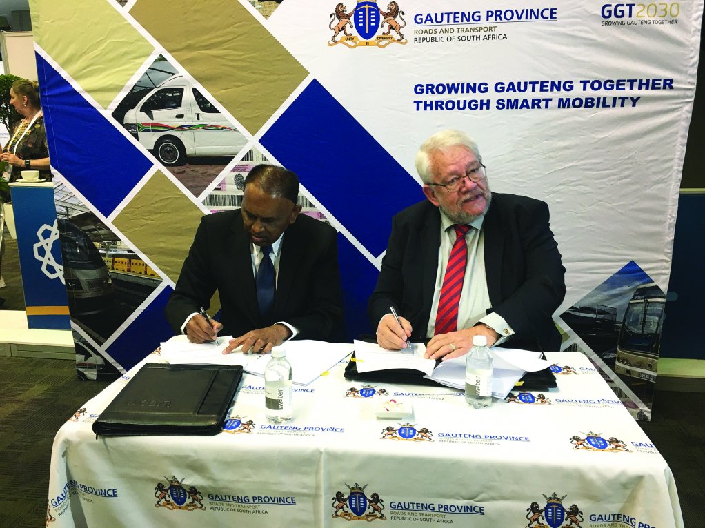 A representative of the CSIR joins GTA CEO Jack van der Merwe in signing the memorandum of understanding to bolster research to grow the Gauteng on the Move initiative.