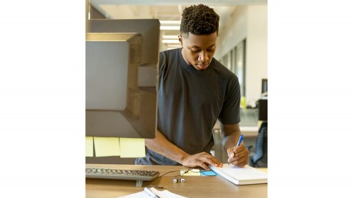 young man working at computer