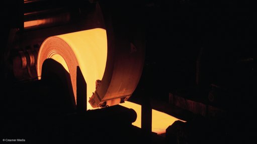 A flat steel coil being rolled at the Saldanha Works before it was mothballed