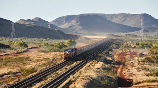 An image of a train transporting iron-ore 