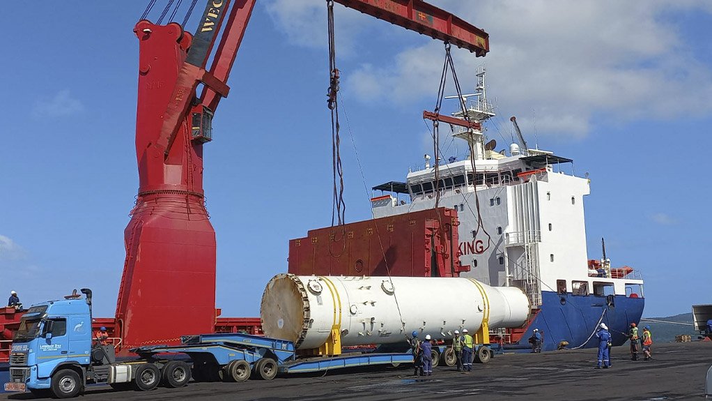 A large element of a gas plant which was dismantled and transported by Lovemore Bros being offloaded and then placed on a ship using heavy materials handling machinery at he Richards Bay port