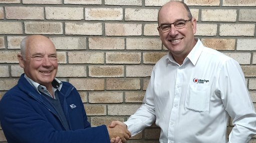 An image depicting MCL’s Rodney Mclagen and Bearings 2000’s Ross Trevelyan shaking hands