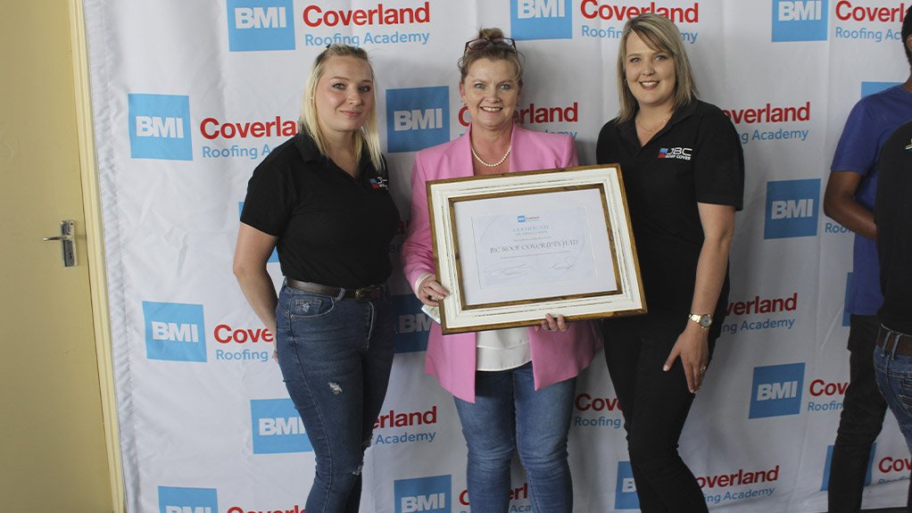 Belinda Conradie and the JBC Roof Cover team accept their award for the large role that they played in launching the concept of an academy dedicated to imparting quality roofing skills