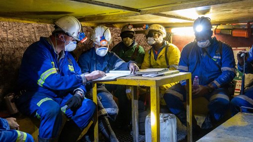 An image of Murray & Roberts contractors at an underground mine 