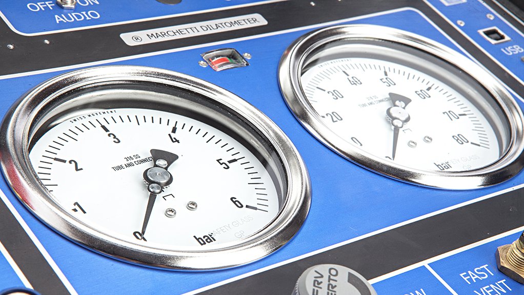 A board with two clocks on with dials on which measures seismic movement on tailings dams at critical points