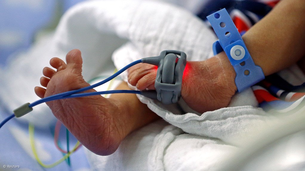a newborn baby's feet in hospital