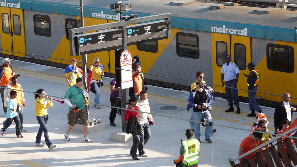 Metrorail train with passengers in foreground