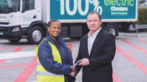 Image of Truck driver Robin Jooste receiving the keys to the Shoprite Group’s first electric truck from CEO Pieter Engelbrecht