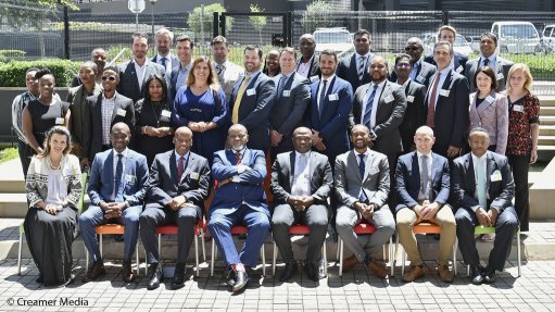 Members of the consortia that signed power purchase and implementation agreements with Eskom and government on December 8 pose for a group photo with Mineral Resources and Energy Minister Gwede Mantahse (front and centre)