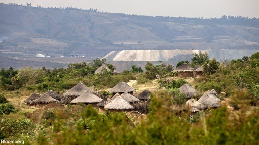 Houses are seen in the village of Kiwanja against the backdrop of the North Mara mine, in Tanzania.