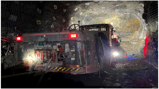 Picture showing Jumbo development drill working underground at Abra (June 2022).