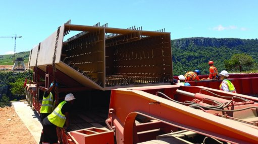 An image showing off-loading of the second box girder for the South Bank segment zero at the Msikaba bridge