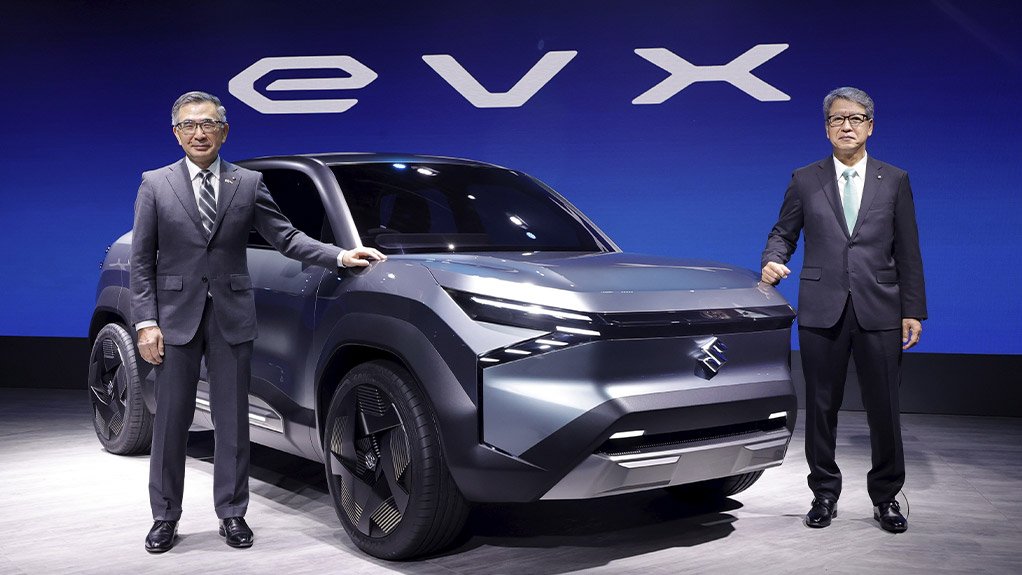 Caption:
POWER UP The Suzuki eVX concept. Left is Image of Suzuki group president Toshihiro Suzuki and Maruti Suzuki CEO Hisashi Takeuchi
with the eVX