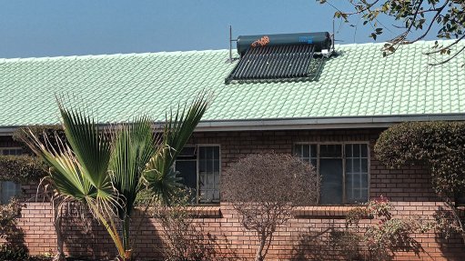 An image showing a solar geyser on a roof 
