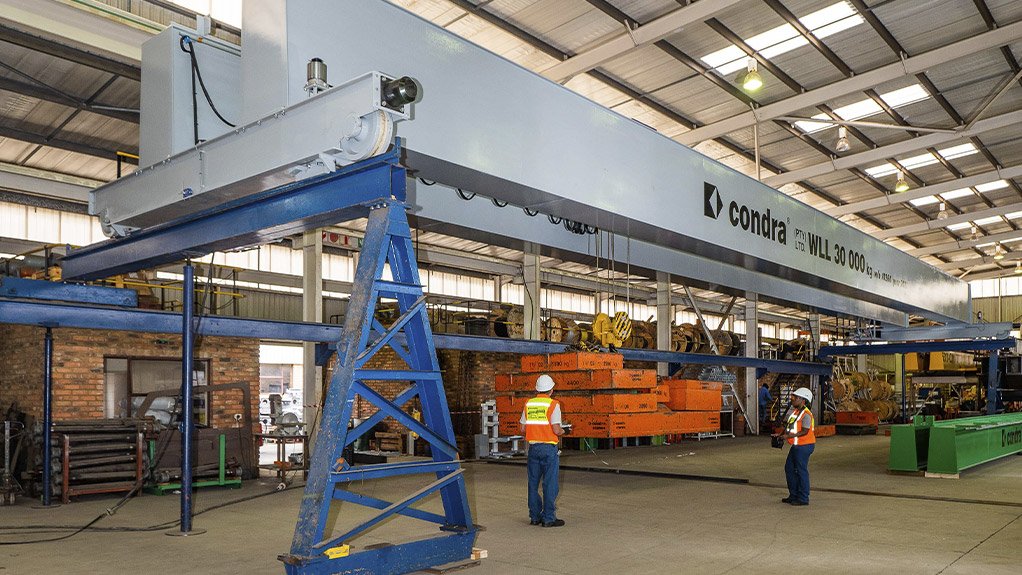 MMC’s crane under load test at Condra’s Germiston factory. The
   special paint finish is MMC Grey, a corporate colour
