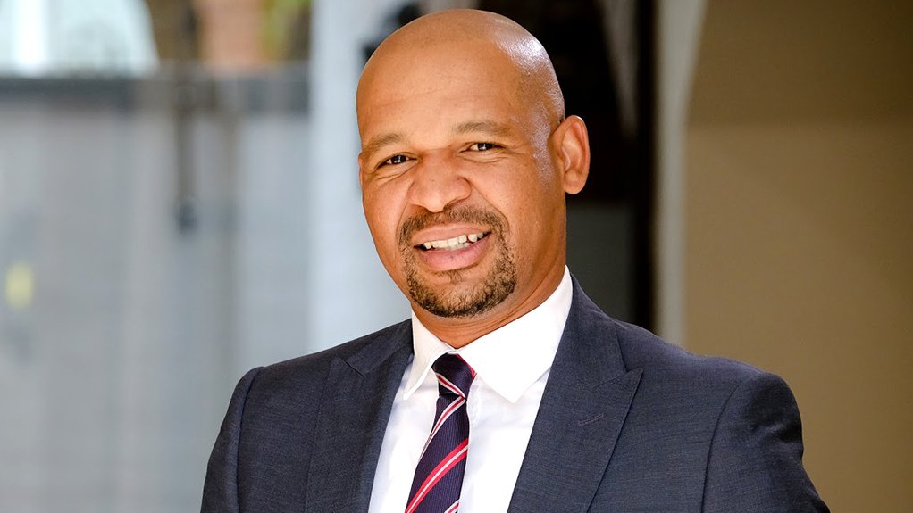 Photo of Agile Capital CEO and founder Tshego Sefolo in a suit and tie.