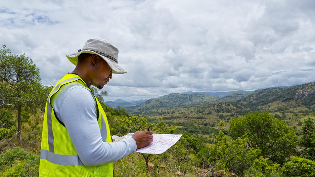 n image of a man analysing biodiversity 