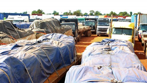 An image of trucks waiting at the DRC border customs clearance checkpoints