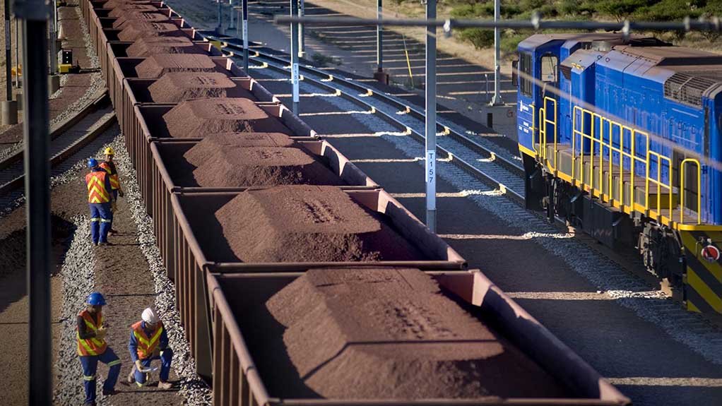 Iron-ore being transported by rail