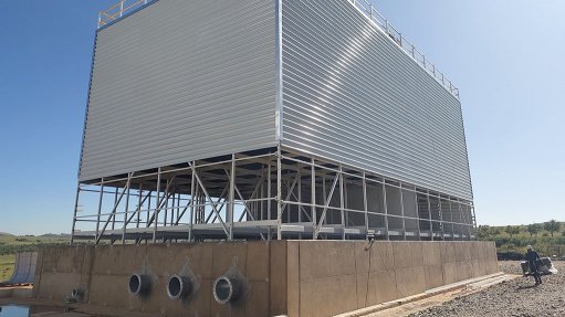 A plltruded glass reinforced polyester condenser cooling tower installed on a mining site.
