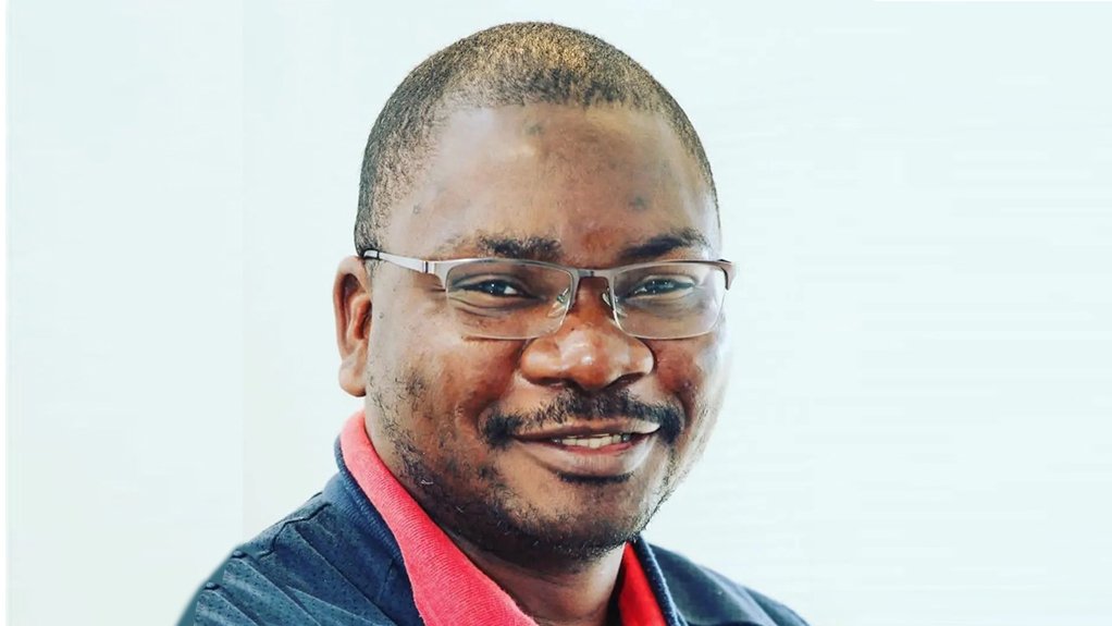 An image depicting a smiling man, Professor Sampson Mamphweli
