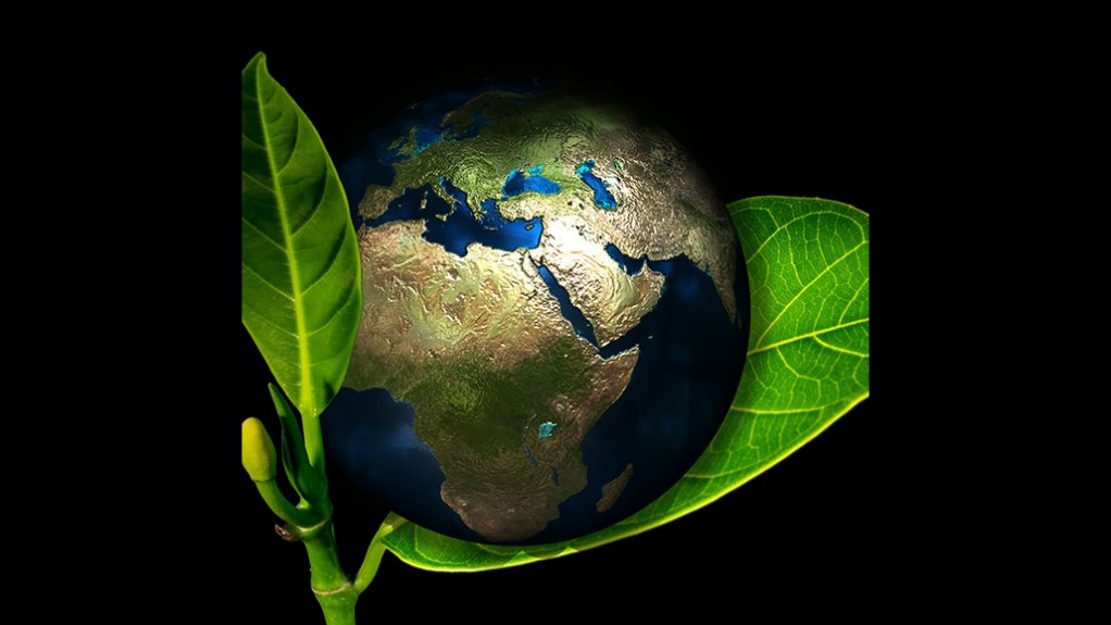 An image of the planet on a green leaf