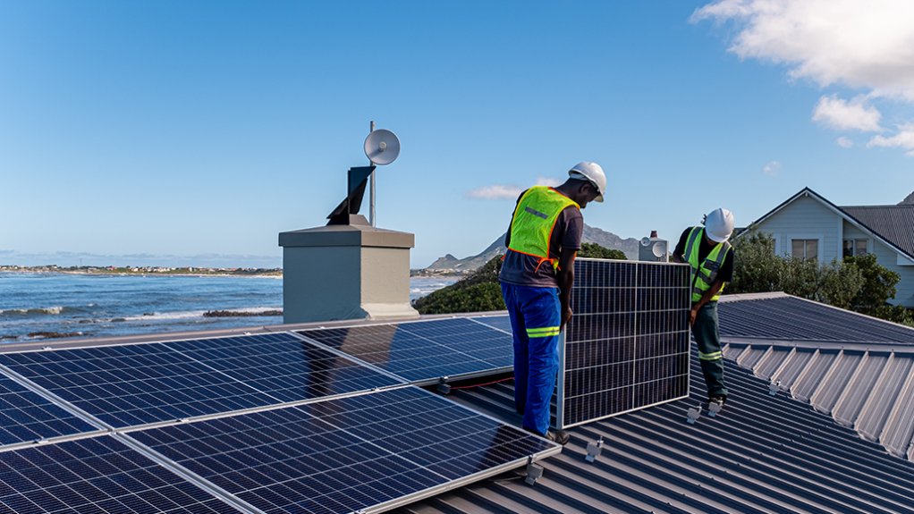 Image of workers installing solar panels 