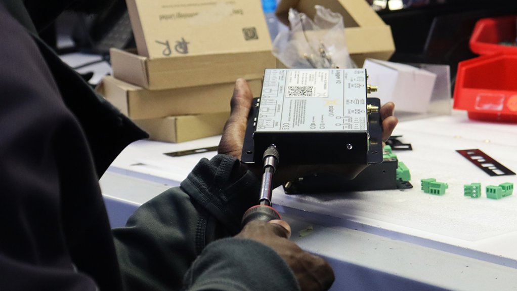 Image of worker working on components 