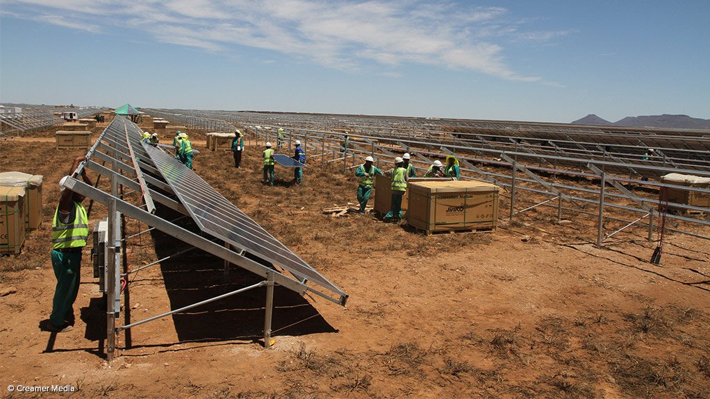 Workers at a solar project