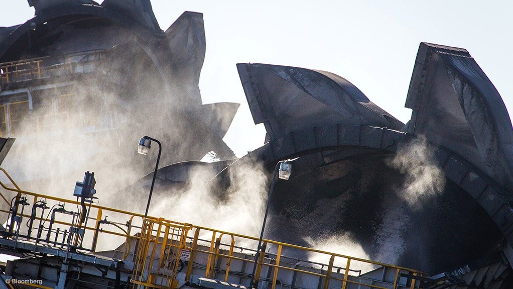 Image shows coal stacks and loaders 