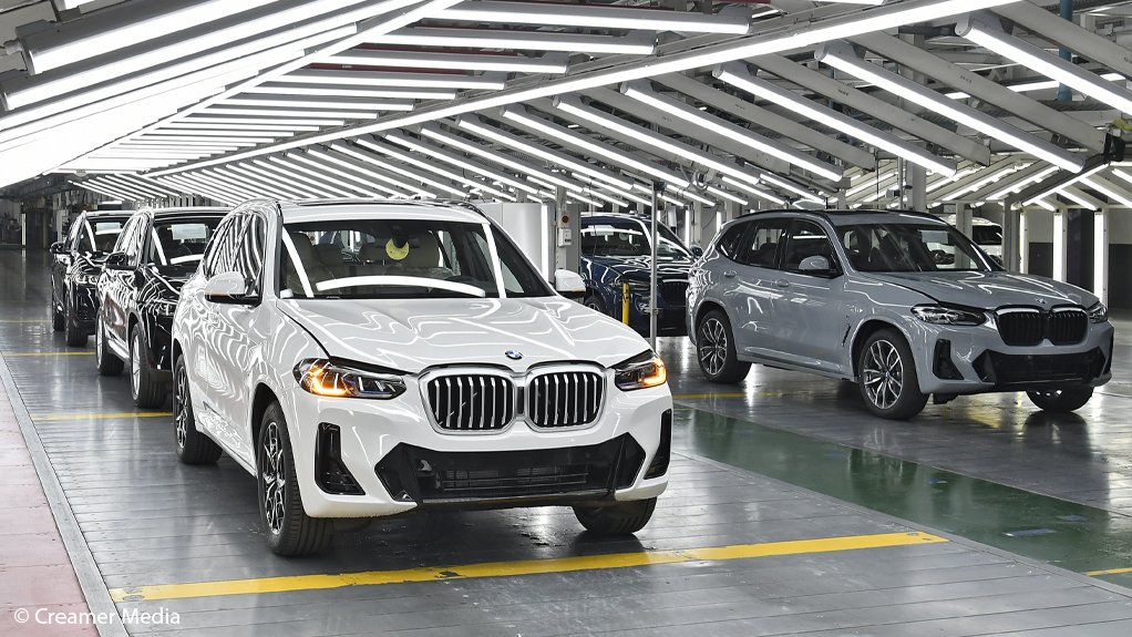 Newly-produced BMW X3’s stand in an inspection booth at Plant Rosslyn