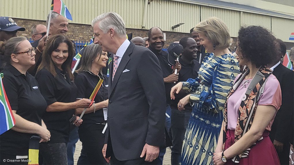 Belgium's King Philippe and Queen Mathilde engage with Beka Schreder employees.