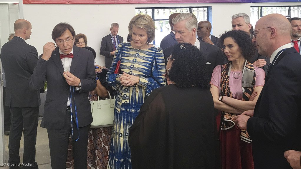 Belgium's King Philippe and Queen Mathilde engage with Beka Schreder employees in its factory.